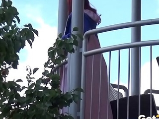 Redhead pees depart from will not hear of balcony in the city